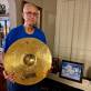 Dad holding the ride cymbal with moms picture laser engraved “iIn Memory “